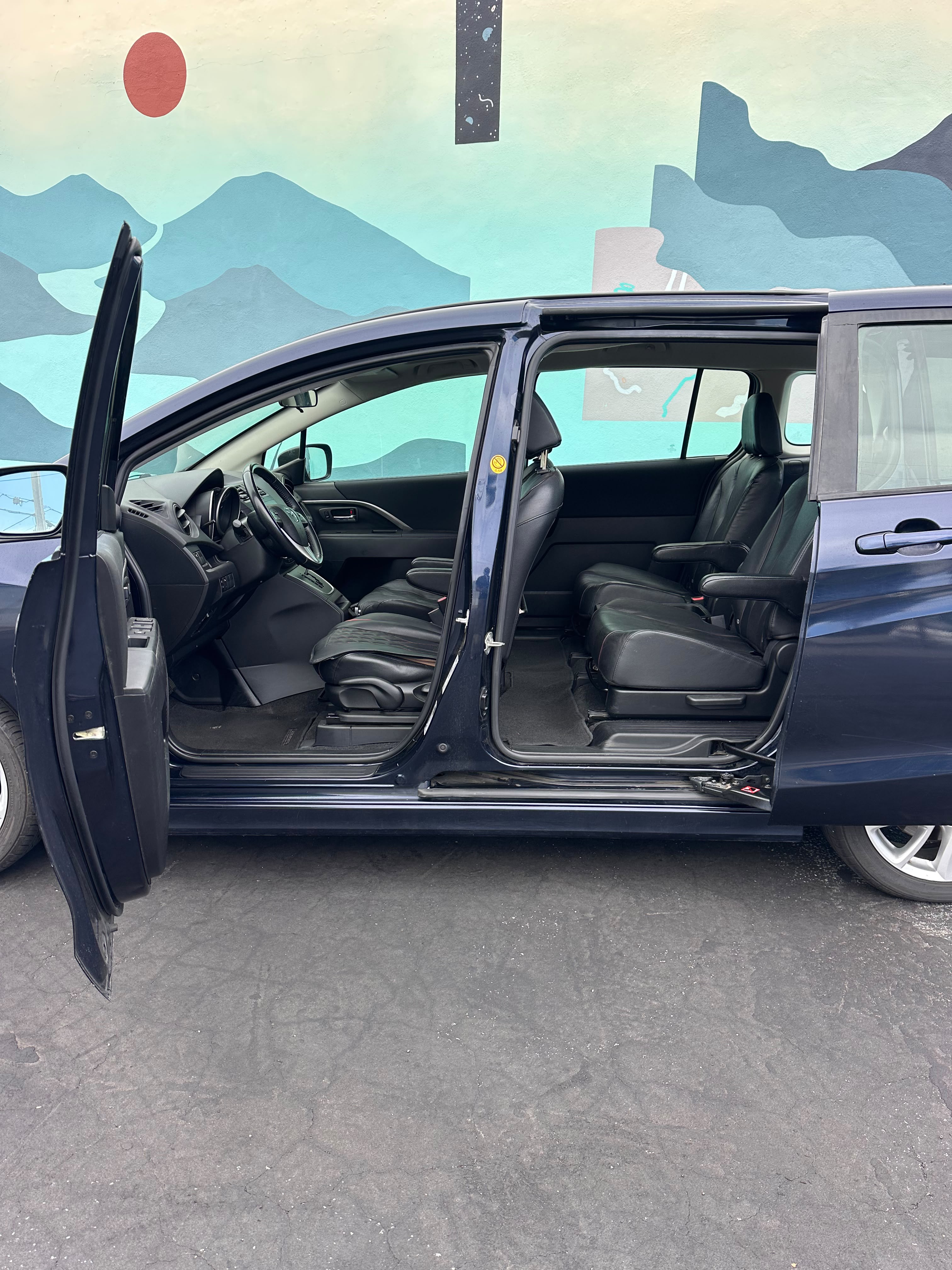 Mazda 5 side view sliding doors compact minivan Santa Cruz airport transfer