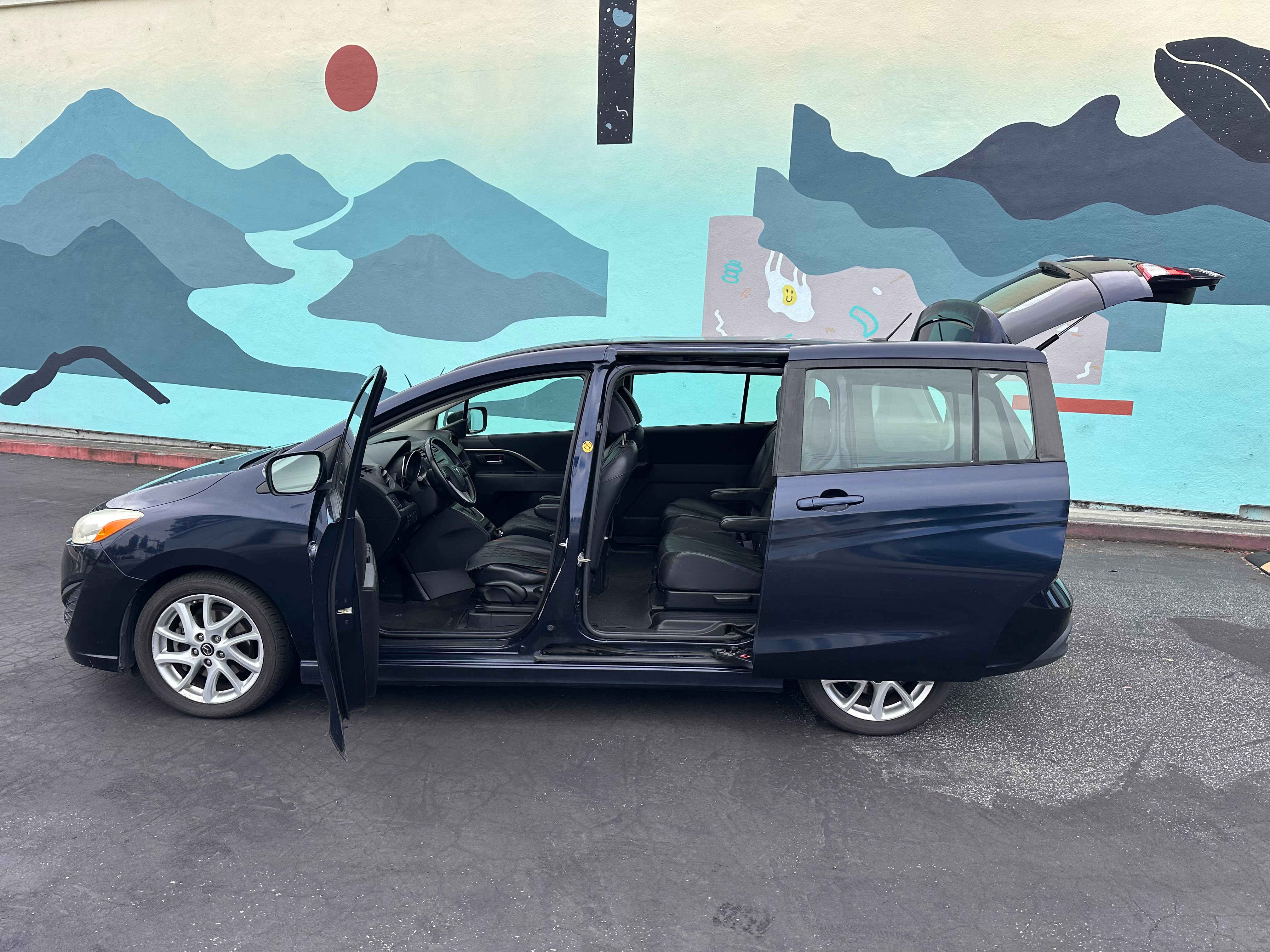 Mazda 5 interior fold-flat seats spacious cabin family trips Santa Cruz CA